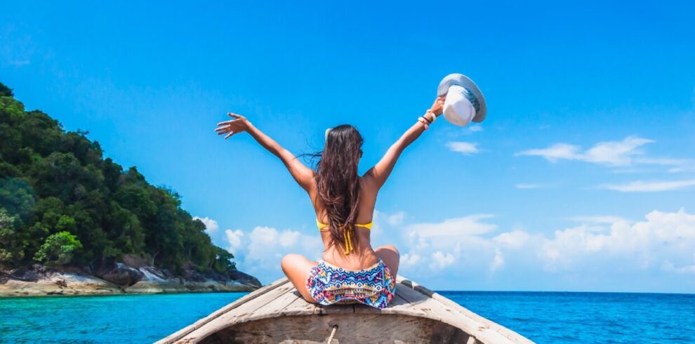 Thailand Tours & Travels - Happy Woman Traveler in Bikini Relaxing on Boat in Thailand Beaches