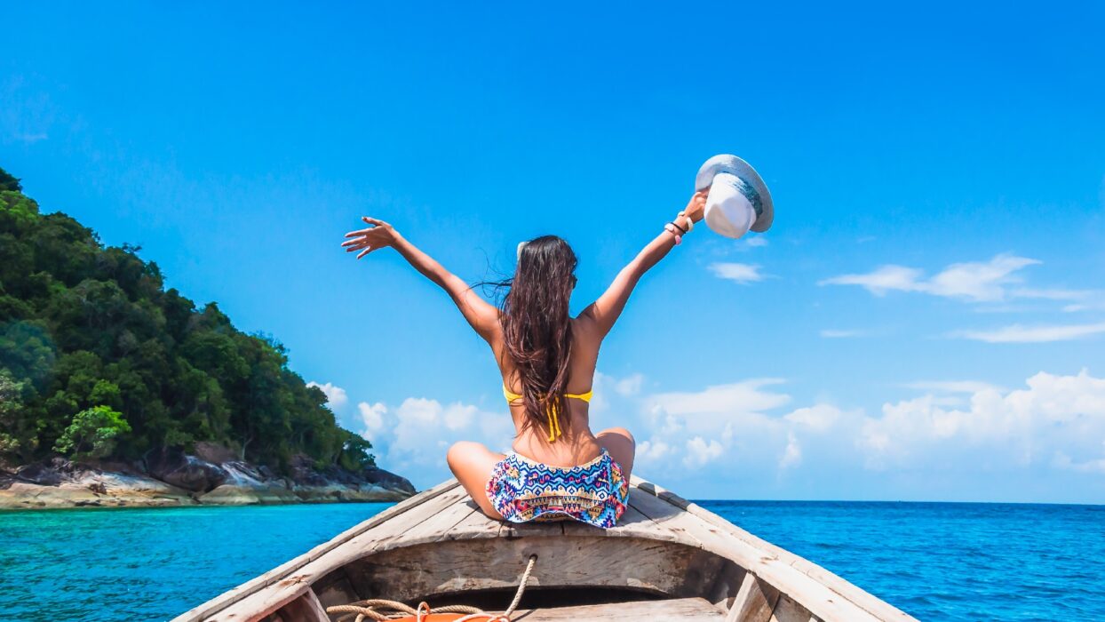 Thailand Tours & Travels - Happy Woman Traveler in Bikini Relaxing on Boat in Thailand Beaches