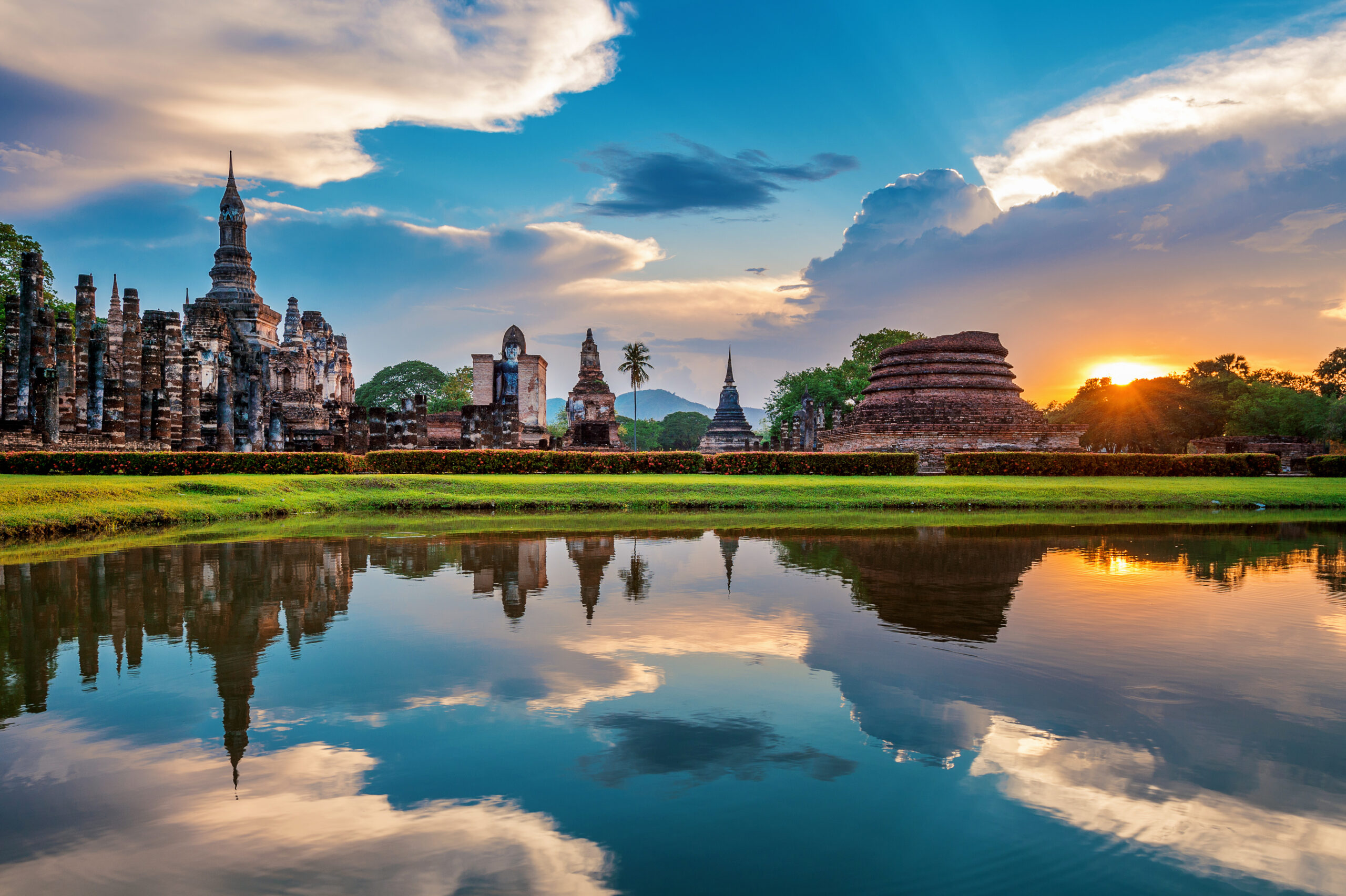 Thailand Tours & Travels - Buddha statue and Wat Mahathat Temple in the precinct of Sukhoth